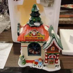 Department 56 North Pole Series The Jolly Fellow Toy Co. Porcelain 2013 Lighted