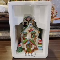Department 56 North Pole Series Ugly Sweater Co. Illuminated Porcelain House 20