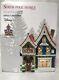 Department 56 North Pole Village Mickey's Pin Traders Lighted House, Brand New