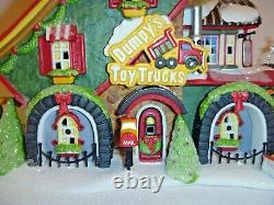 Dept 56 North Pole Village Dumpy's Toy Trucks building