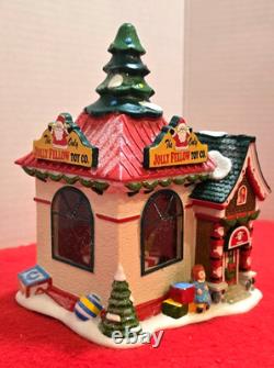 Dept 56 North Pole Village Jolly Fellow Toy Co 4035571 Mint Mint Missing 2 Flags