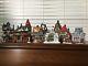 Dept 56 North Pole Village Set/8, Six Houses And Two Accessories