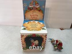 Enesco North Pole Village. Seamer With Santa